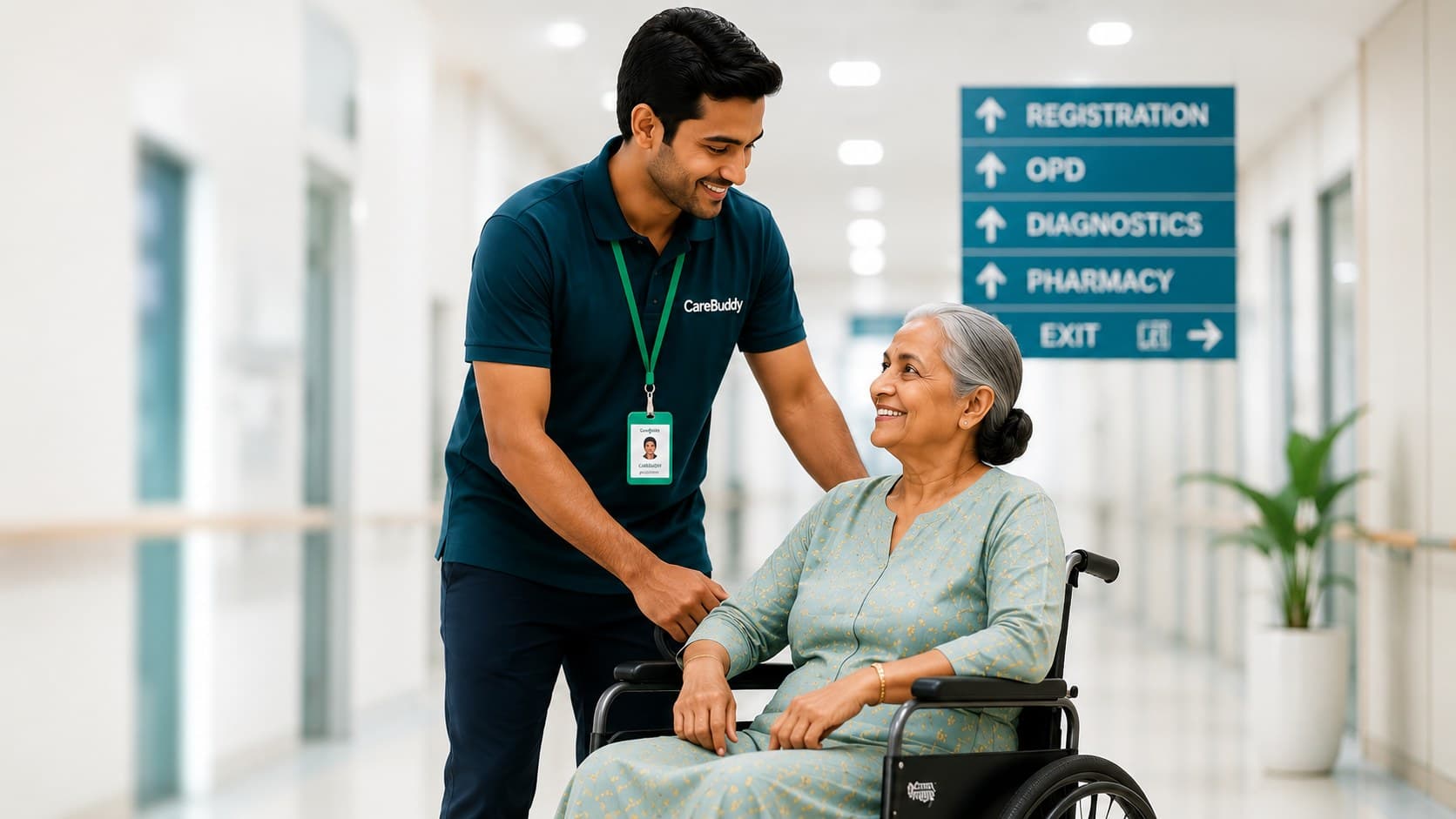 A CareBuddy assisting a patient in a wheelchair through a hospital corridor with directional signage